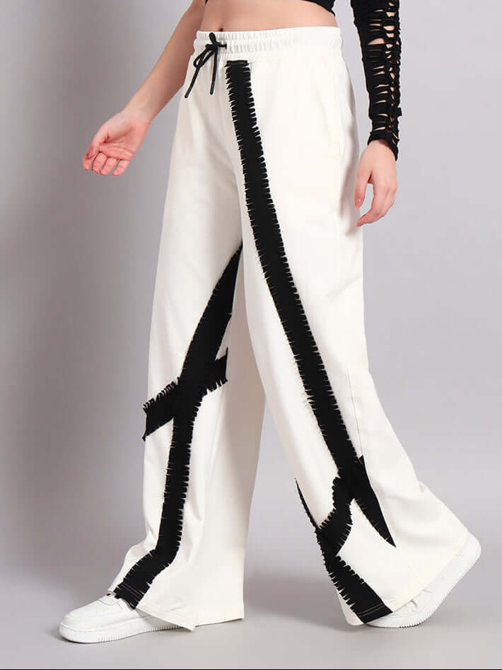 Women's off-white jogger with frayed textured stripes, customizable fit, crafted by skilled tailors at DUDS. Made-to-order fashion.