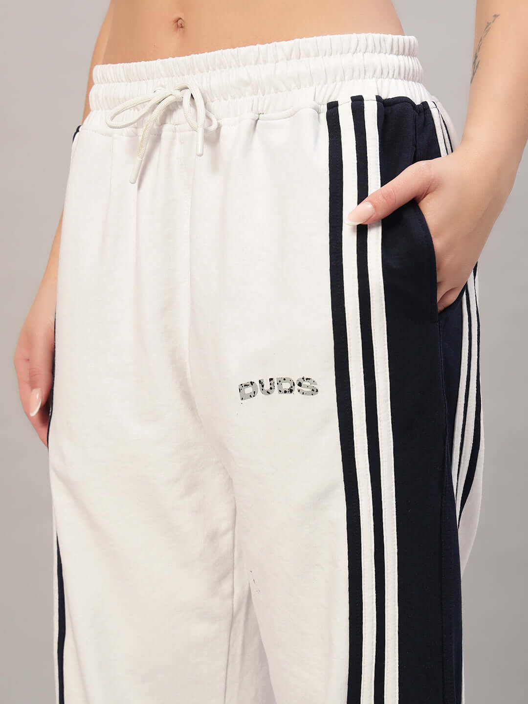 Women's Frenzy Curve Contrast Joggers in white and navy by DUDS, featuring side stripes and elastic waistband.