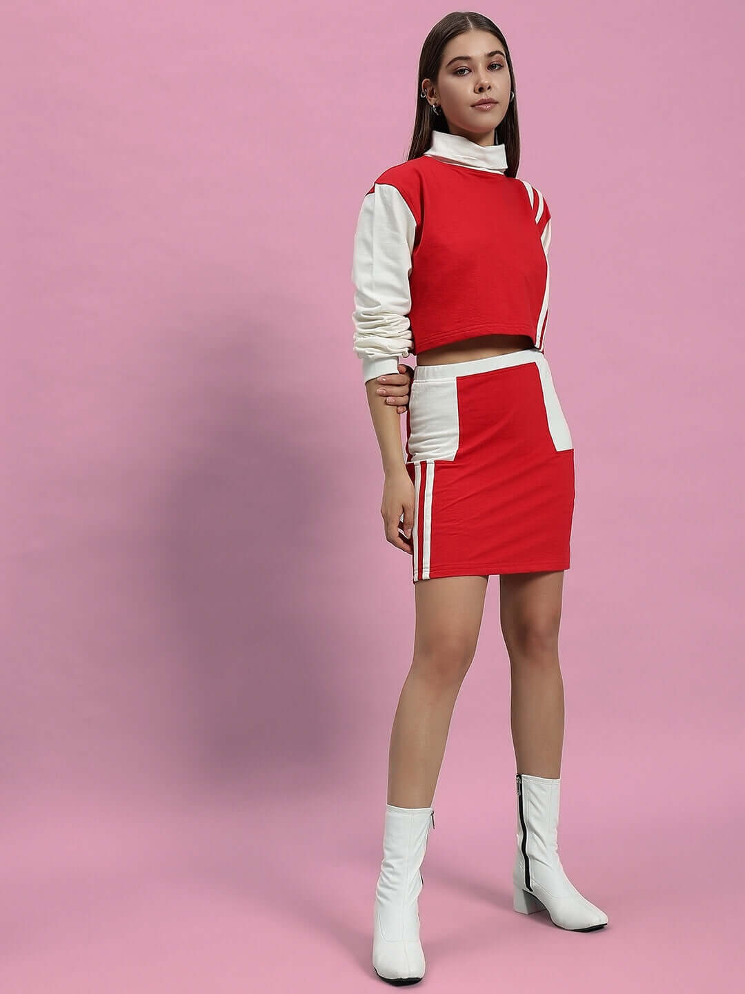 WOMEN FREYA CO-ORD SET OFF WHITE RED on model, showcasing chic and sporty design with red and white color scheme.