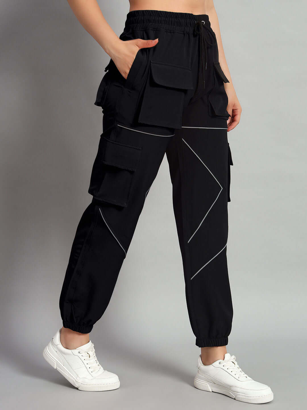 Women wearing WOMEN FRONTLINE REFLECTOR PARACHUTE CARGO PANTS BLACK, showcasing comfort and utility style.