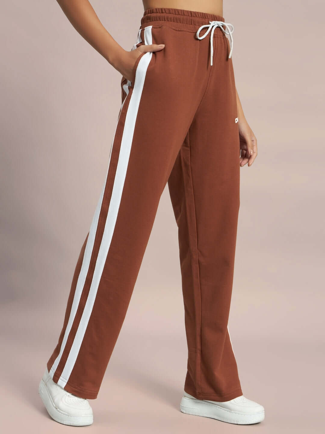 Women's brown joggers with two white stripes, featuring an elastic waist and custom fit option by DUDS.