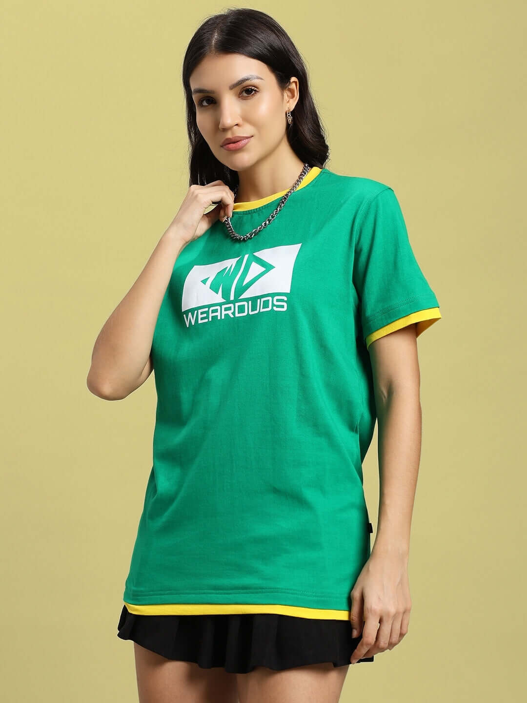 Woman wearing a green WOMEN'S ELMER Regular Fit T-Shirt made of 100% cotton, styled with a contrasting yellow neckline and hem.
