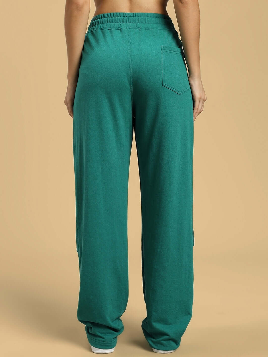 Back view of WOMENS AWESOME FLAP POCKET BAGGY JOGGER GREEN showcasing relaxed fit and stylish comfort.