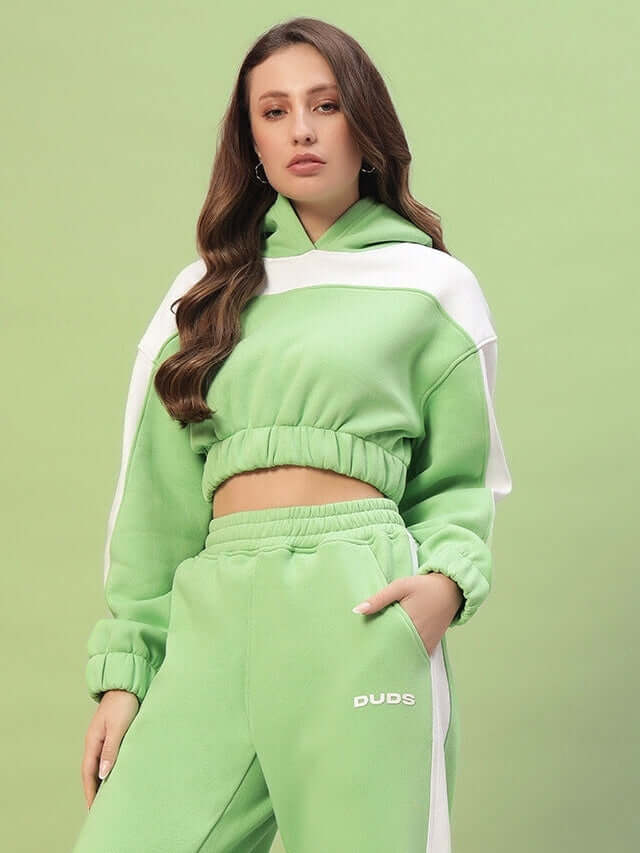 Woman wearing Women's Rizzler Colorblock Co-ord in green with a relaxed-fit top and pants, showcasing modern casual fashion.