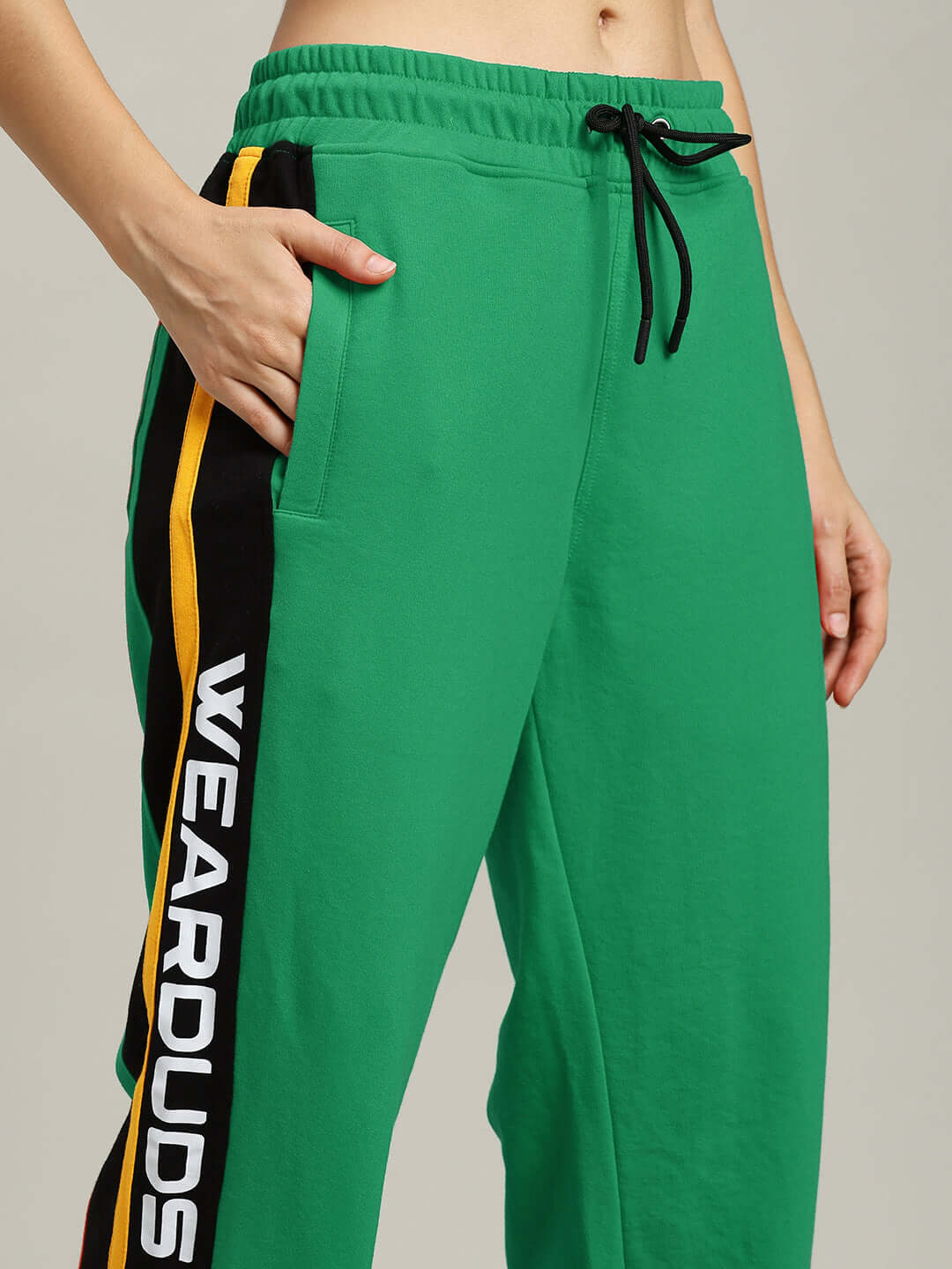 WOMENS ROGER RELAXED-FIT JOGGERS GREEN with side stripe design, elastic waistband, and adjustable drawstrings for casual wear.