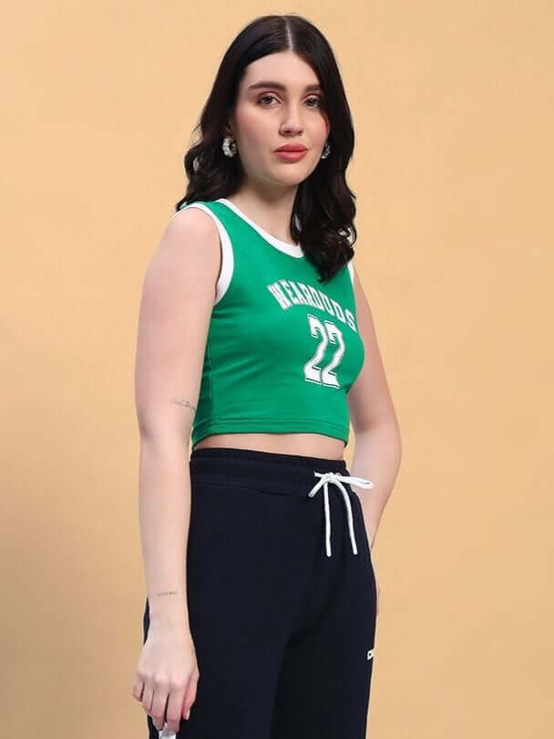 Woman wearing green-white crop-top, styled with black pants, showcasing women's premium cotton crop-top design.