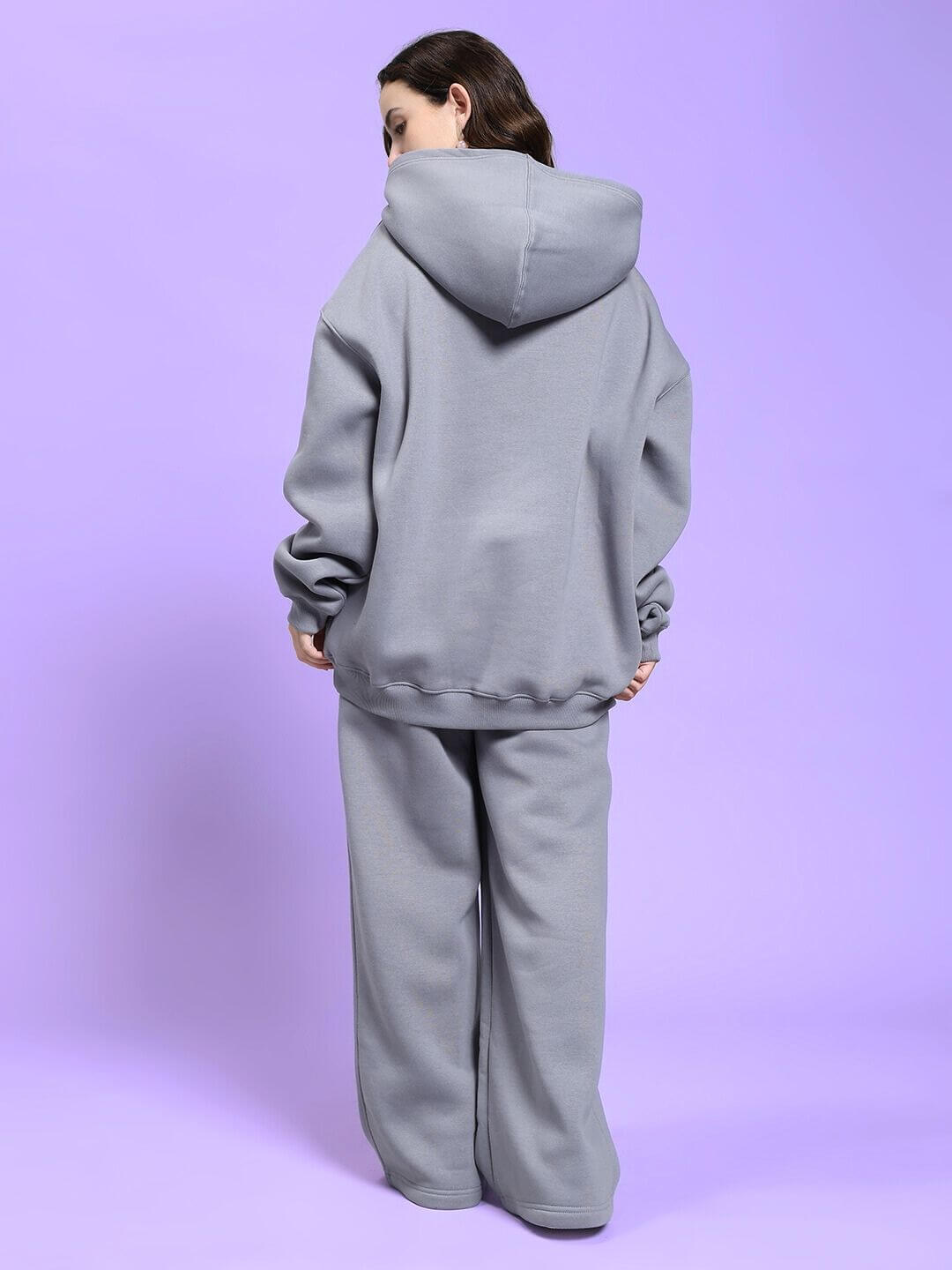 Back view of model wearing WOMEN MAKE IT HAPPEN FLEECE CO-ORD SET GREY highlighting cozy streetwear style.