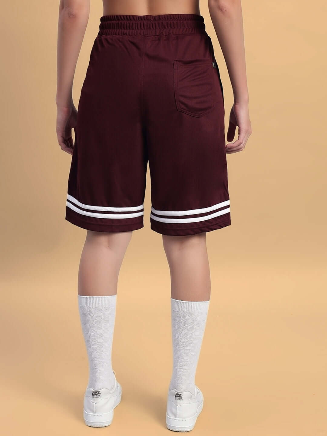 Back view of WOMEN'S GROOVY COLORBLOCK CO-ORD SET WINE shorts showcasing style and comfort in burgundy with white accents.