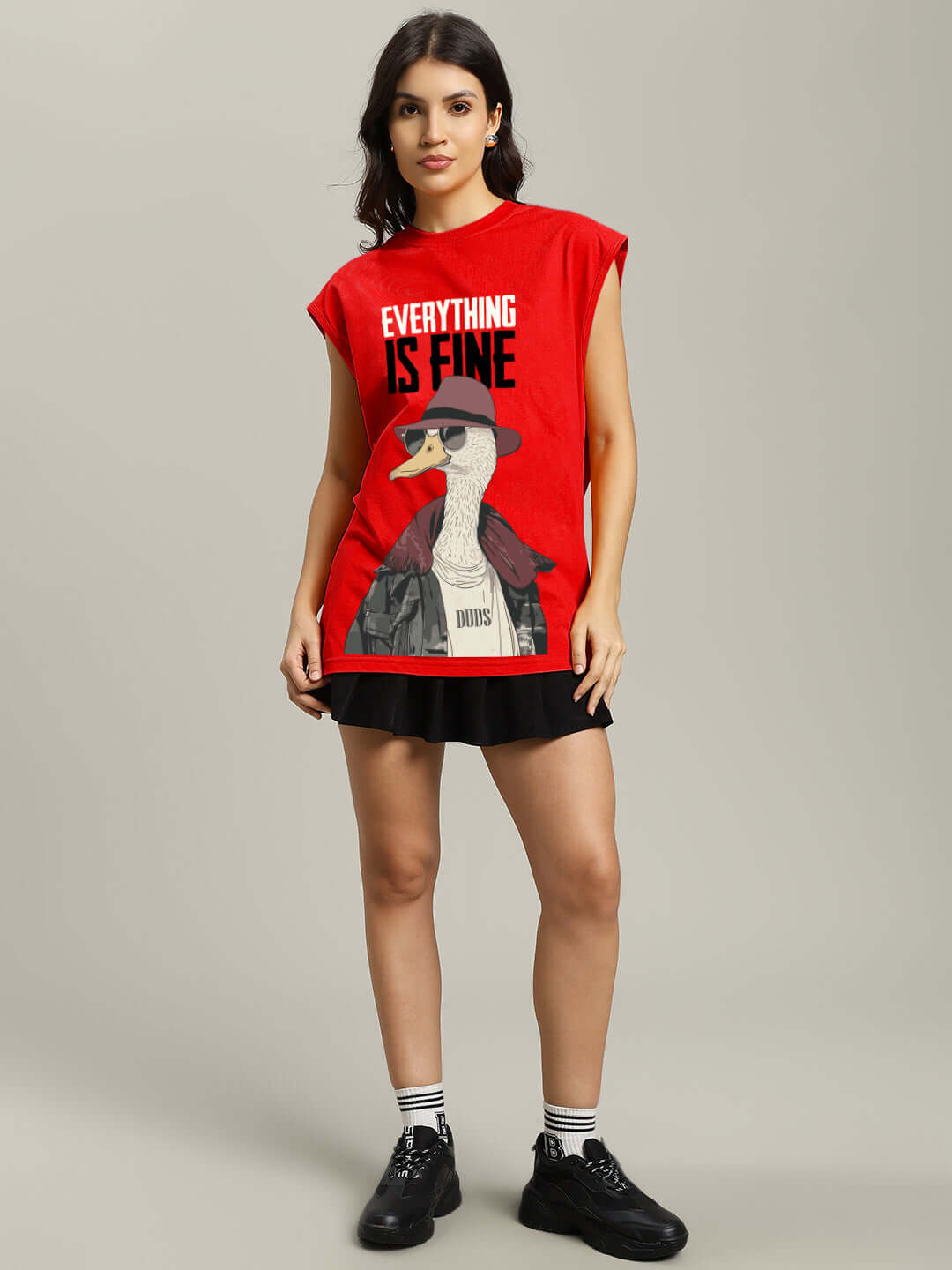 Woman wearing red gym t-shirt with 'Everything is Fine' graphic design, standing casually.