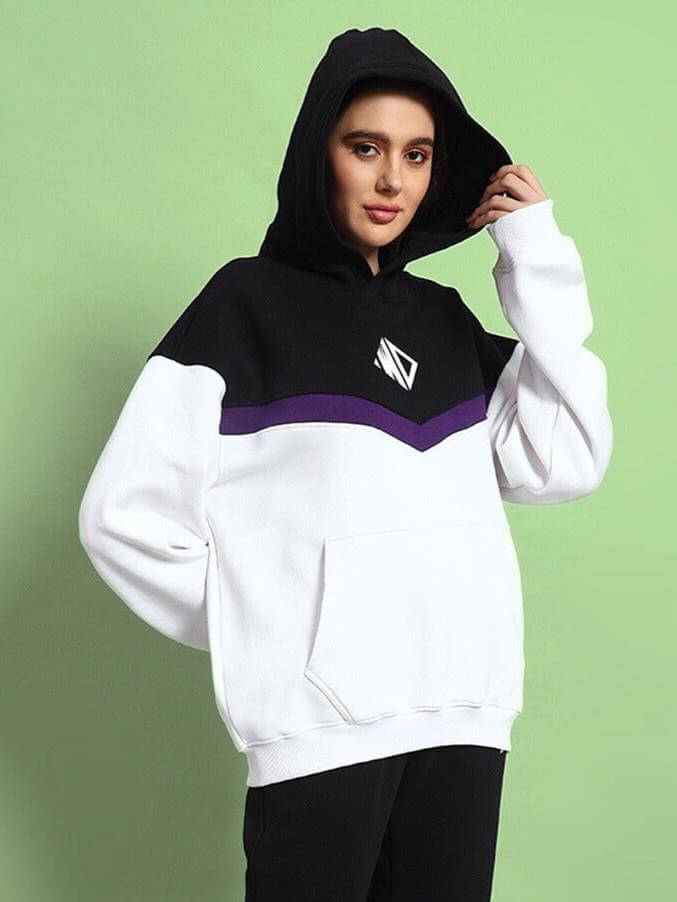 Model wearing Women Harley Fleece Colorblock Hoodie White Purple with hood up against green background.
