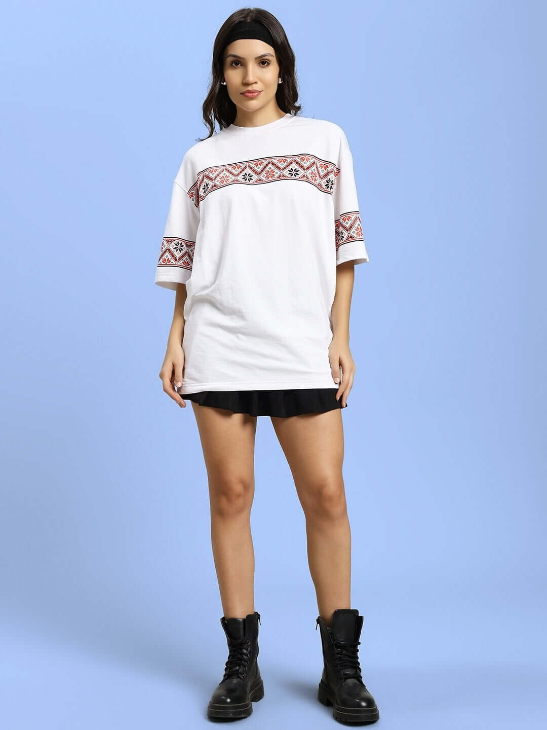 Model wearing women's white printed Vyshyvanka t-shirt with headphones ornament design, featuring premium cotton fabric.