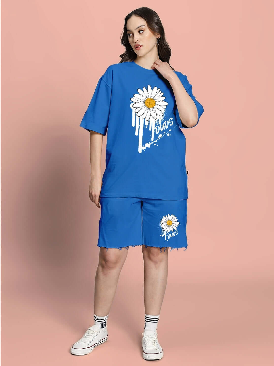 Model wearing WOMEN'S HELIANTHUS SUMMER CO-ORD SET BLUE with daisy print, featuring premium cotton fabric