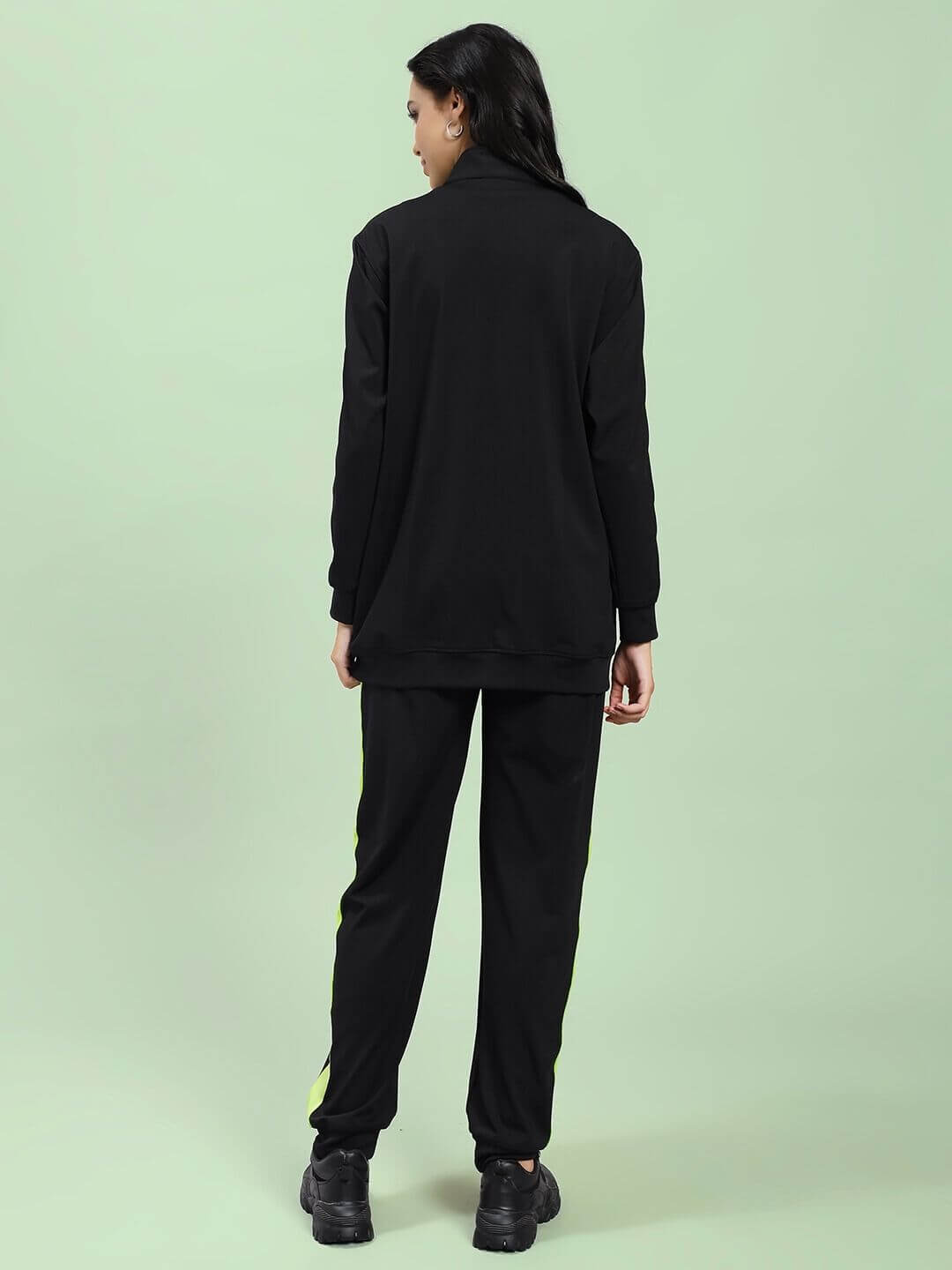 Back view of WOMEN HIGH PERFORMANCE CO-ORD SET BLACK with breathable fleece, featuring a zip-up hoodie and tapered joggers for athleisure style.