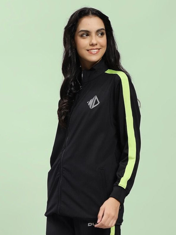 Woman wearing WOMEN HIGH PERFORMANCE JACKET IN BLACK, sleek design for outdoor activities and fashion.