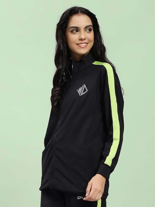 Woman wearing WOMEN HIGH PERFORMANCE JACKET IN BLACK, sleek design for outdoor activities and fashion.