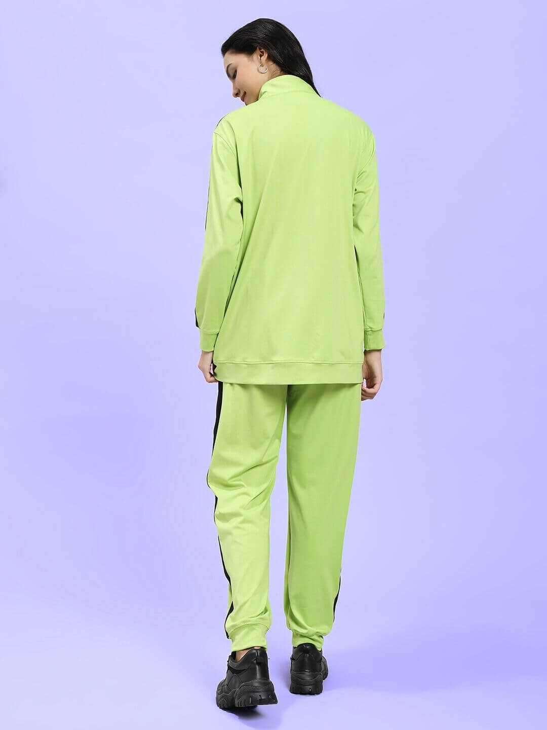 Back view of WOMEN HIGH PERFORMANCE CO-ORD SET NEON GREEN with sporty design on model.
