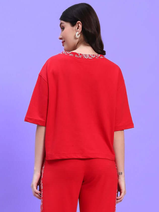 Back view of WOMEN'S HOLLY RELAXED FIT TOP RED showcasing casual chic design for modern streetwear.