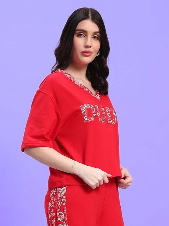 WOMEN'S HOLLY RELAXED FIT TOP RED by WEAR DUDS, featuring a stylish and comfortable design ideal for modern streetwear.