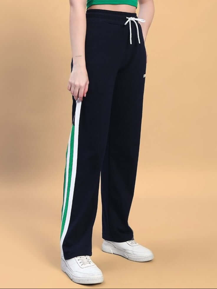 Women's navy blue joggers with green contrast stripe, featuring a drawstring waistband.