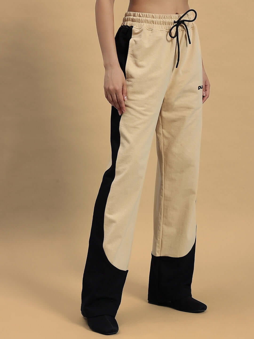 Women's Hurtle Baggy Joggers in Beige-Black by DUDS, front view showing stylish design and drawstring waist, customizable for perfect fit.
