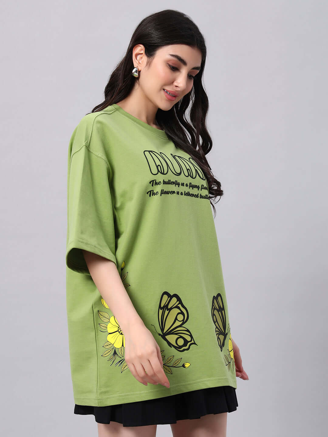 Woman wearing green WOMEN'S IKON BUTTERFLY T-SHIRT with butterfly design, soft premium fabric, 97% cotton, comfortable fit.