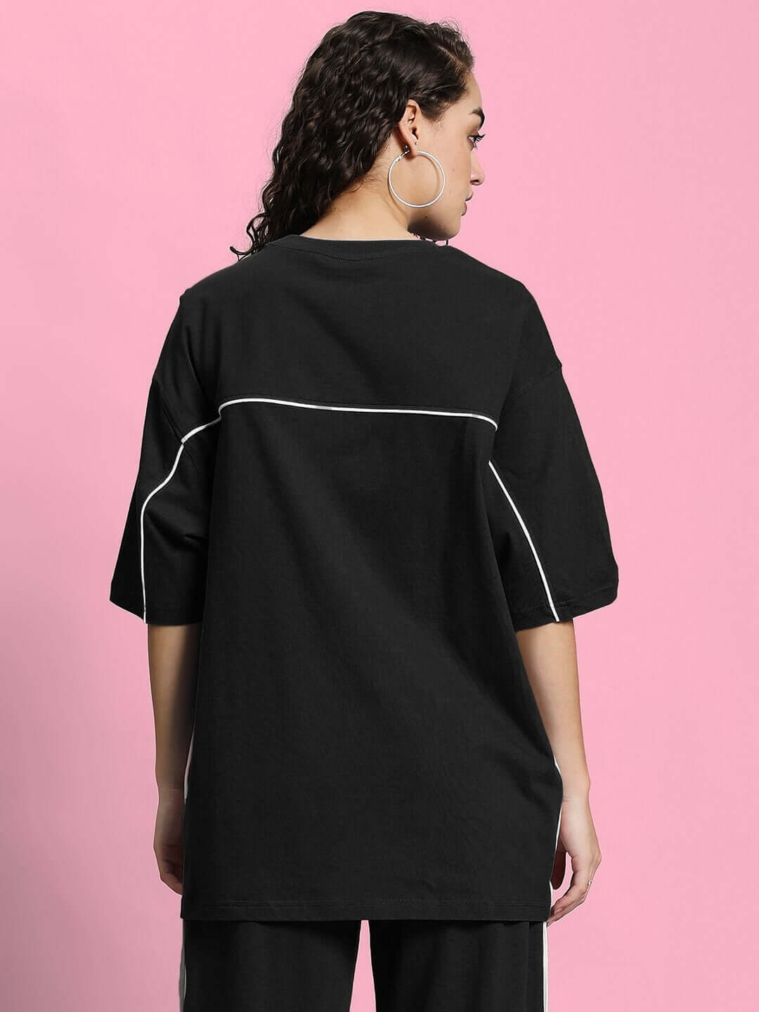 Back view of WOMEN'S INDY OVER-SIZED CLASSIC T-SHIRT BLACK in premium fabric, featuring contrast piping details.