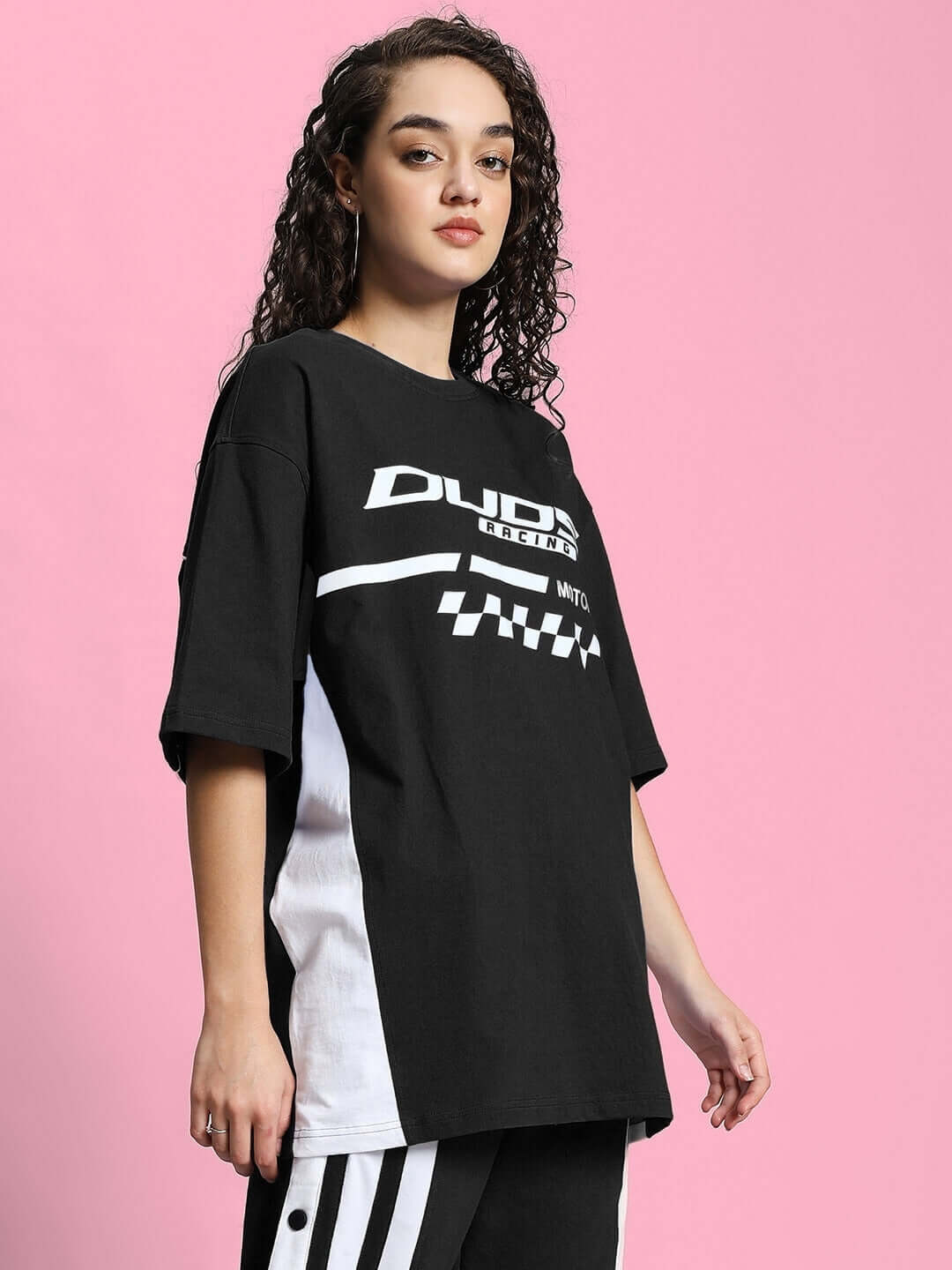 Woman wearing WOMEN'S INDY OVER-SIZED CLASSIC T-SHIRT BLACK made of premium cotton fabric.