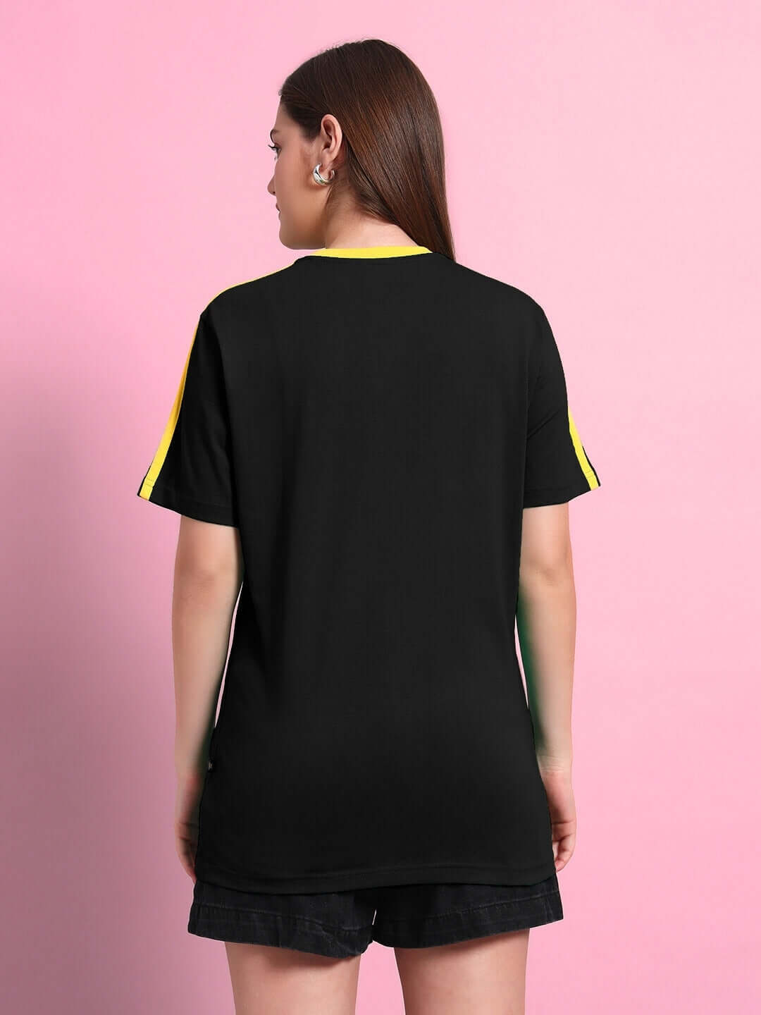 Back view of a Woman wearing a Women's Irish Regular Fit T-shirt in black with yellow striped sleeves, made of 100% cotton.
