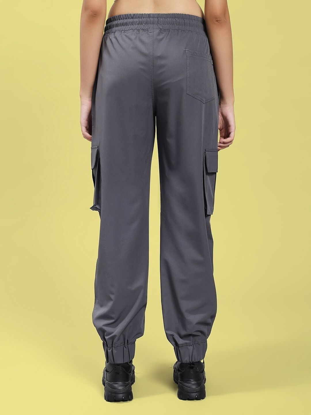 Rear view of WOMEN'S JACK RELAXED FIT MULTI POCKET CARGO DARK GREY showcasing multiple pockets and relaxed fit style.
