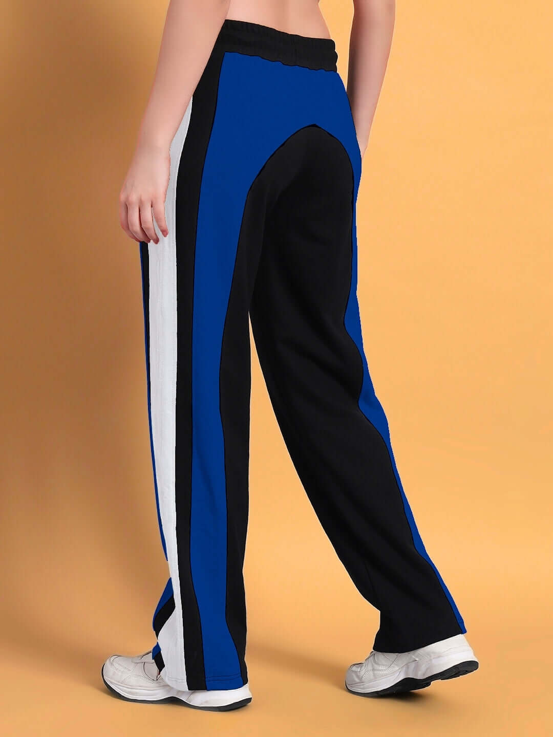 Women's Jamison color block joggers in black and blue, relaxed fit, back view showcasing design details against beige background.