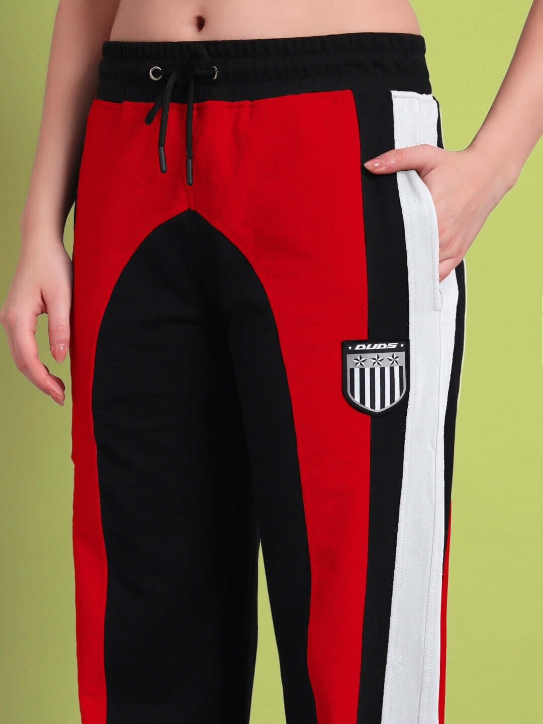 Women's Jamison color block relaxed-fit joggers in black, red, and white, featuring custom fit option from DUDS.