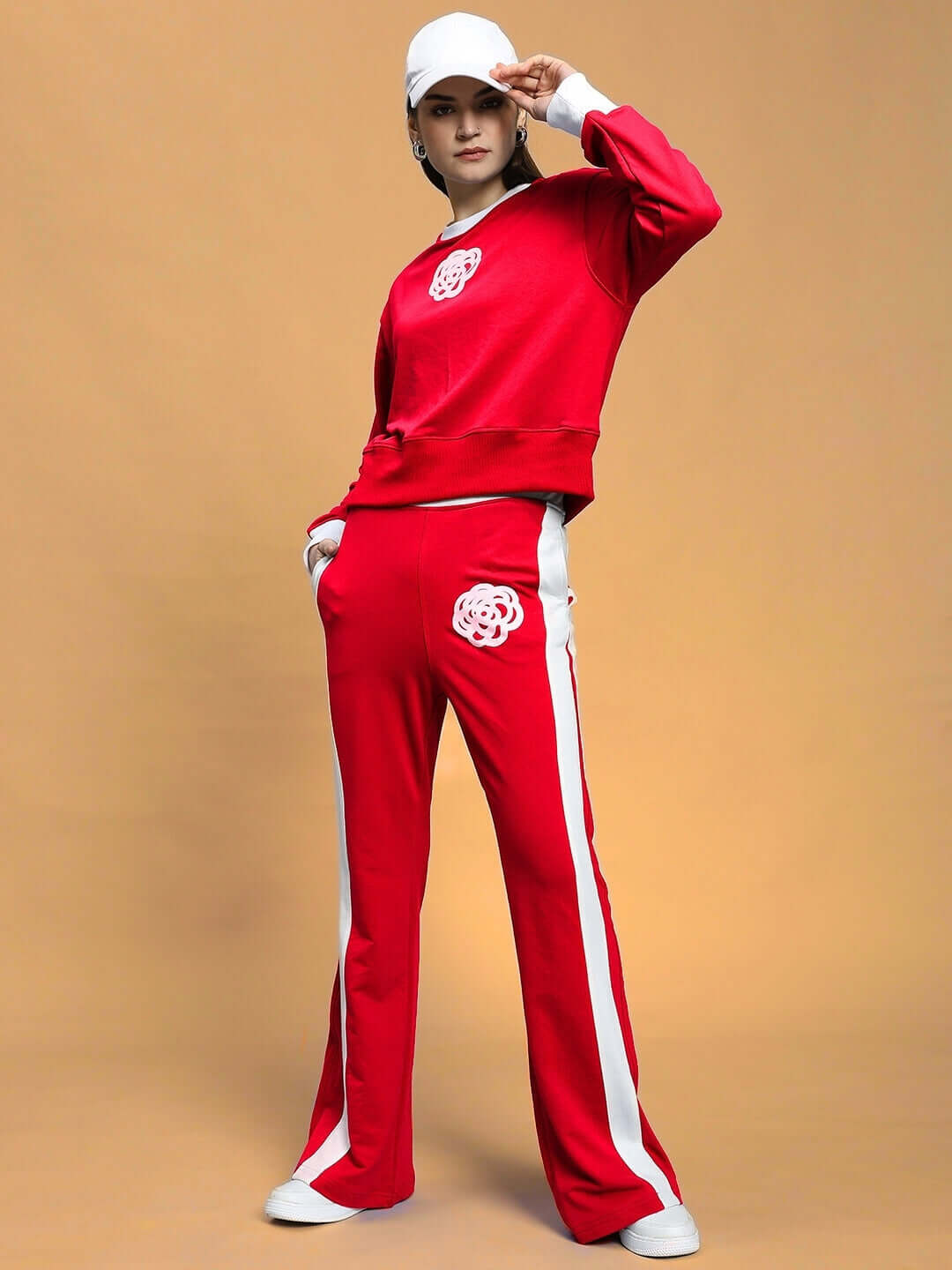 Model wearing WOMEN'S JESSFLICK RELAXED FIT CO-ORD SET RED, featuring streetwear style, from WEAR DUDS, in breathable cotton-blend fabric.