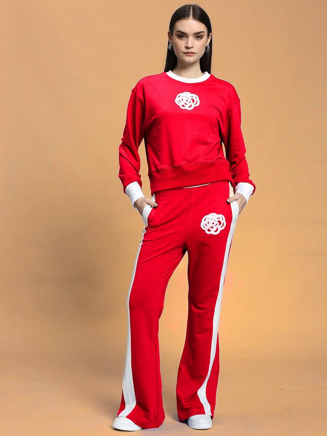 Woman wearing WOMEN'S JESSFLICK RELAXED FIT CO-ORD SET RED in stylish pose, showcasing bold streetwear fashion from WEAR DUDS.
