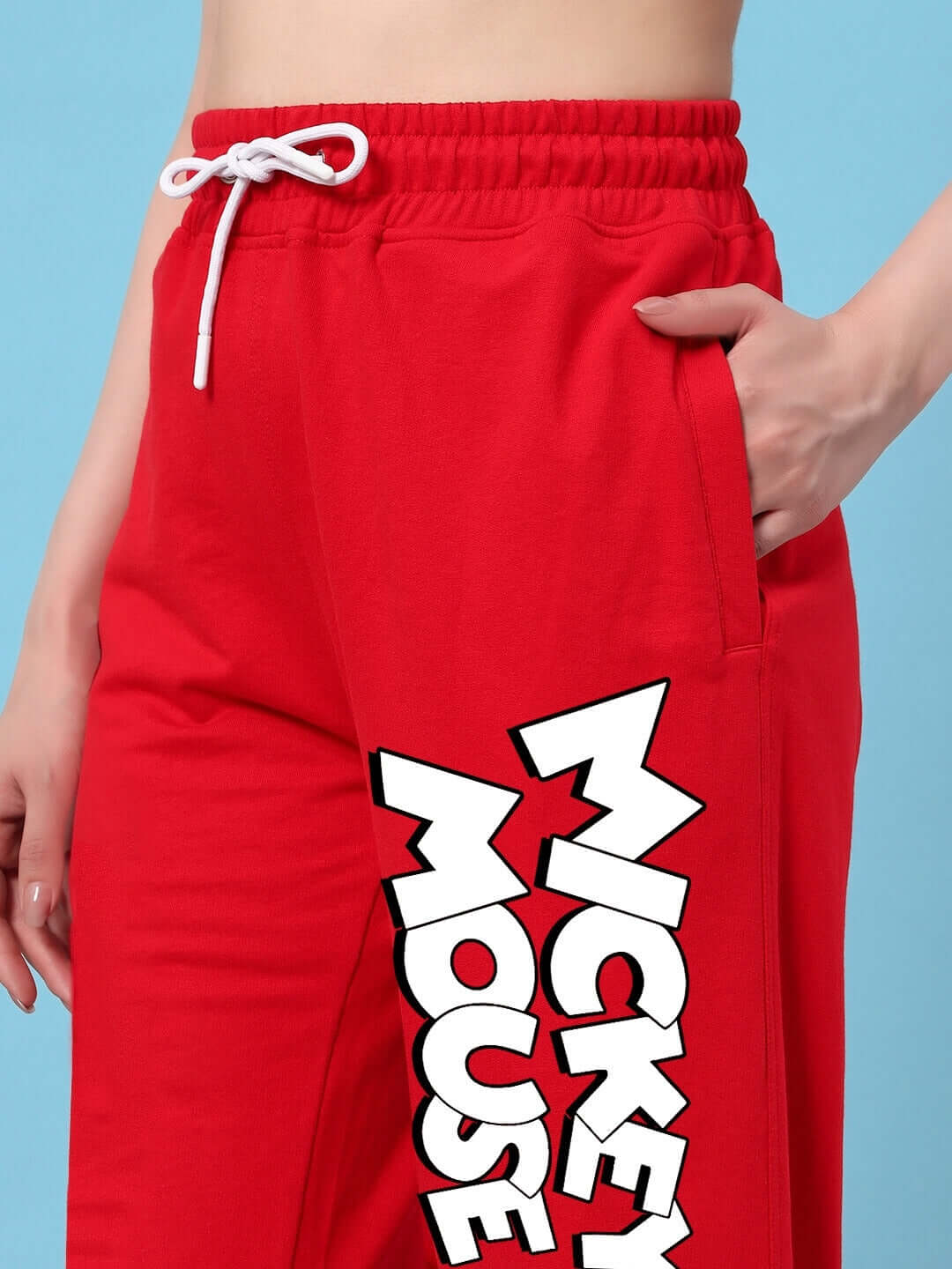 Close-up of red Mickey Mouse relaxed fit jogger for women, featuring side pockets and drawstring, designed by DUDS.