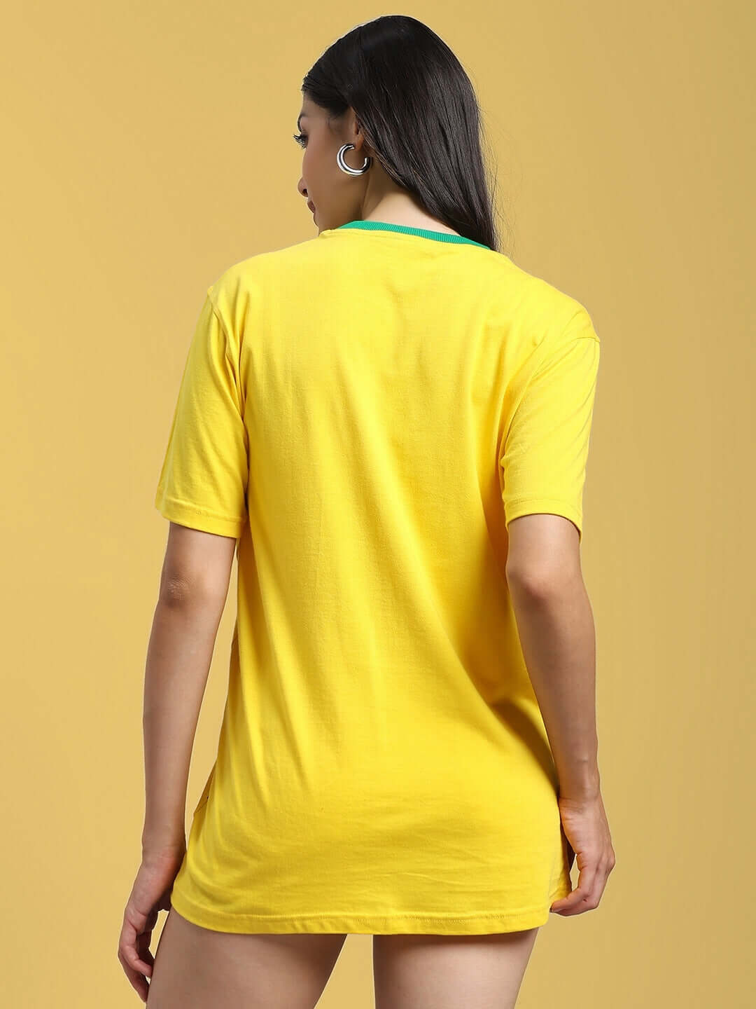 Back view of a woman wearing a yellow-green women's regular fit t-shirt made of 100% cotton. Suitable for casual wear or outings.