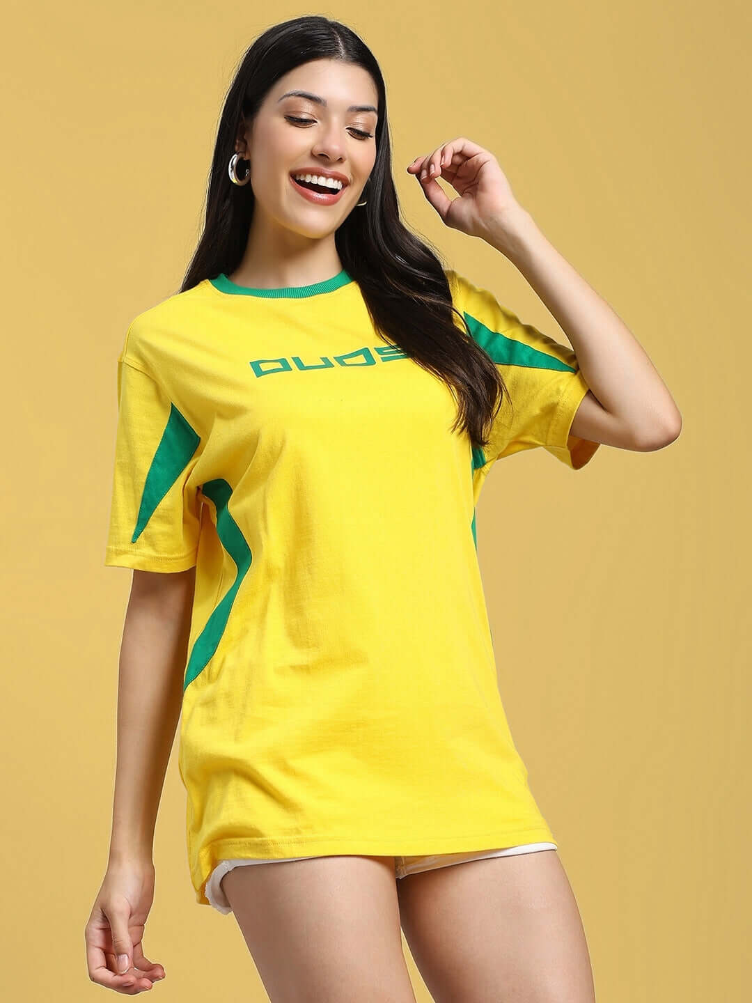 Woman wearing a yellow-green regular fit t-shirt with a bold design, made of premium 100% cotton fabric, perfect for casual wear.
