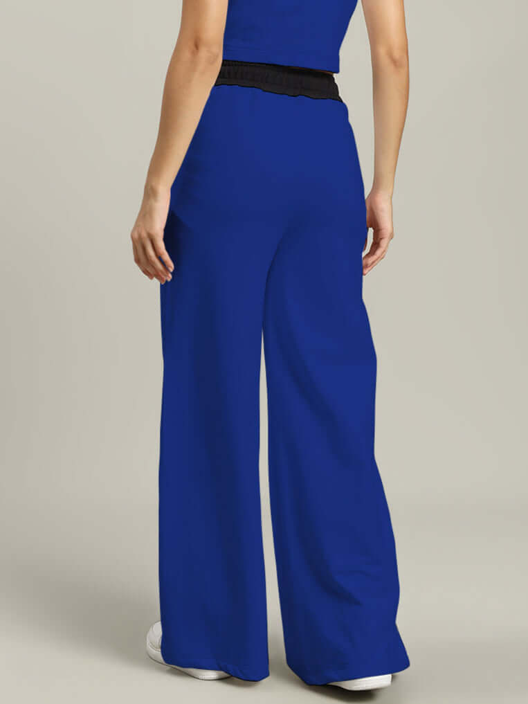 Back view of Women's Larissa Wide Ankle Relaxed-Fit Joggers in royal blue and black, showcasing comfortable and stylish design.