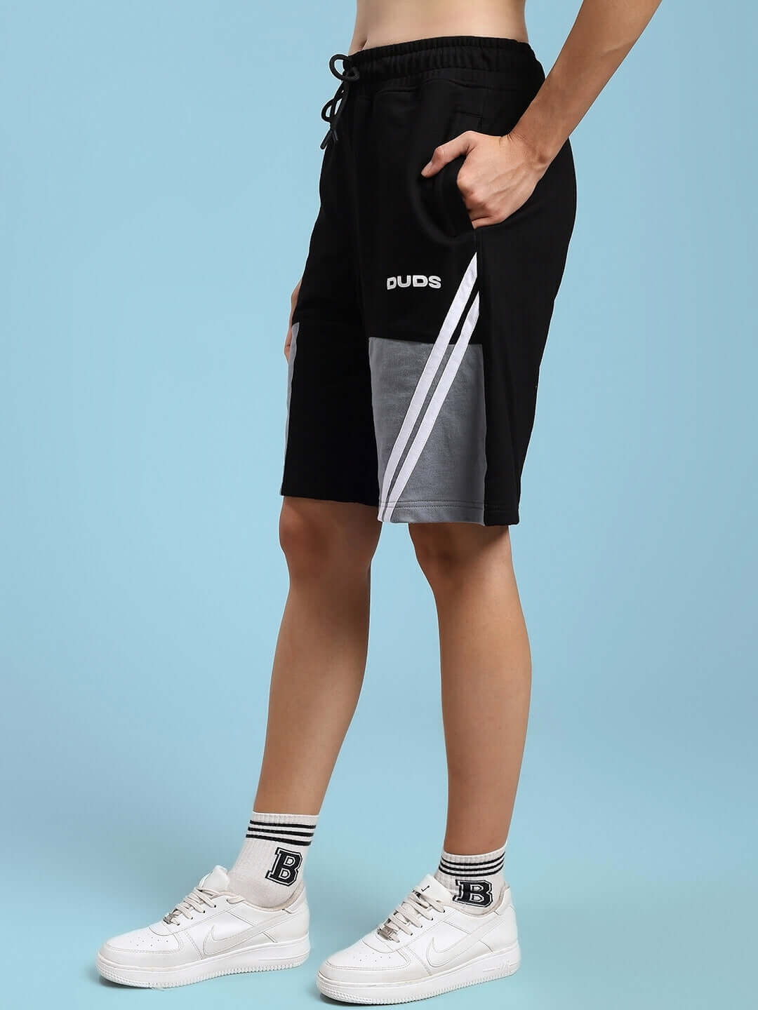 Model wearing Women's Lewin Chino Regular Fit Shorts in Black-Grey by DUDS, featuring a stylish design with customization option available.