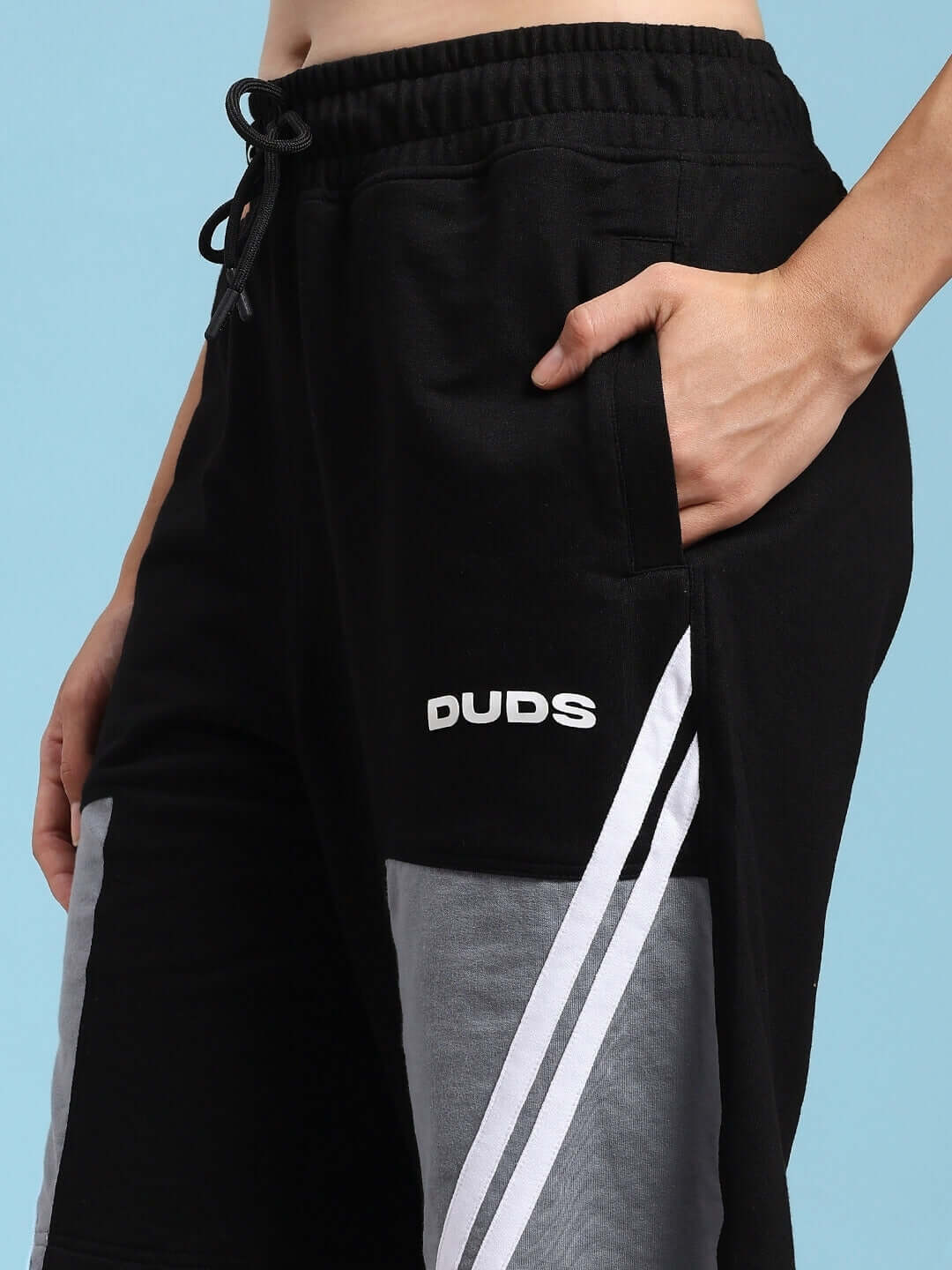 Close-up of a person wearing black-grey DUDS Lewin Chino Regular Fit Shorts with drawstring waist and side pocket.