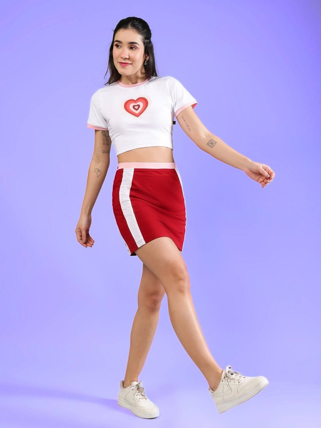 Model wearing WOMEN'S LIBI HEART ACTIVE CO-ORD SET WHITE-RED by WEAR DUDS, stylish streetwear with heart design, comfortable and sporty.