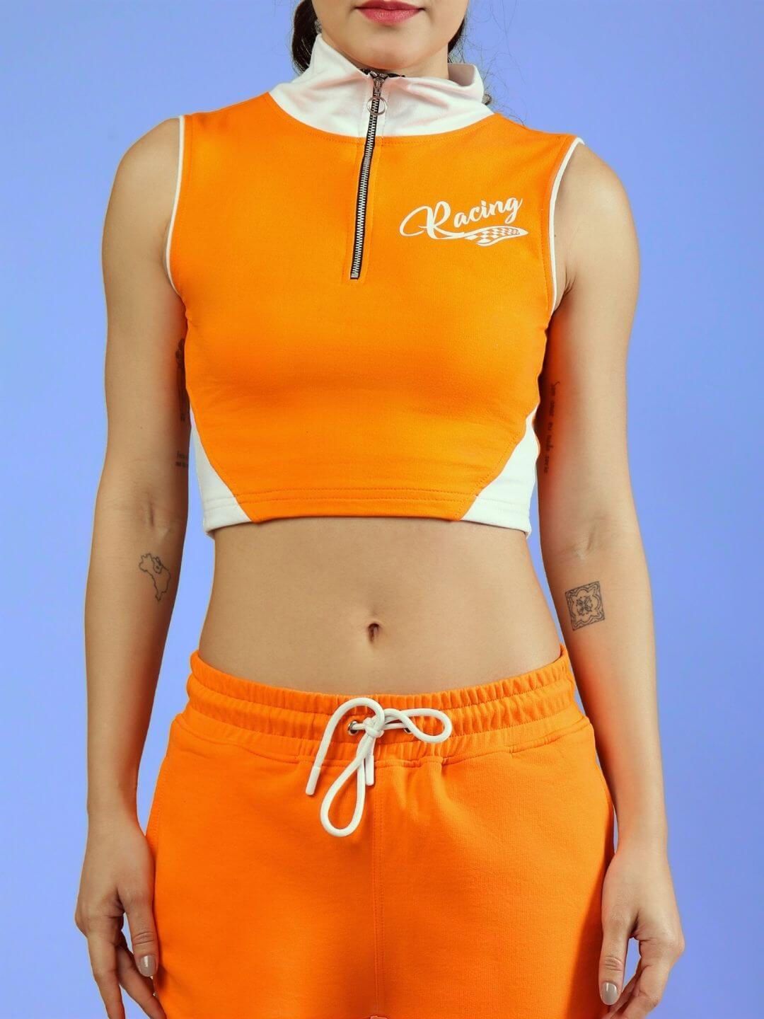Model wearing WOMEN'S LIMA ACTIVE CO-ORD SET ORANGE with sleeveless zip top and drawstring pants by WEAR DUDS.
