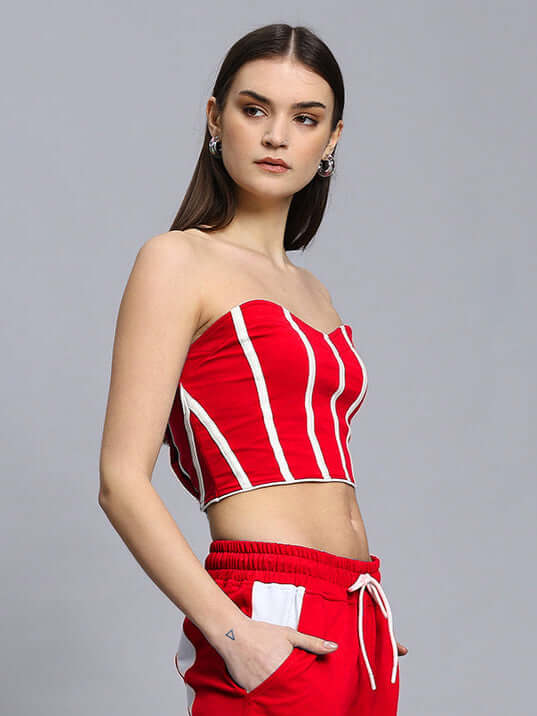 Woman wearing red Liviana Cool Bandeau Top made from premium heavy gauge cotton fabric, featuring vertical stripes and strapless design.