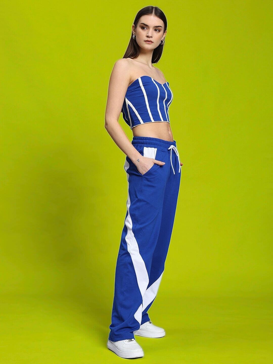 Model wearing WOMEN'S LIVIANA COOL CO-ORD SET BLUE-WHITE from WEAR DUDS, featuring blue-striped top and blue-white pants.