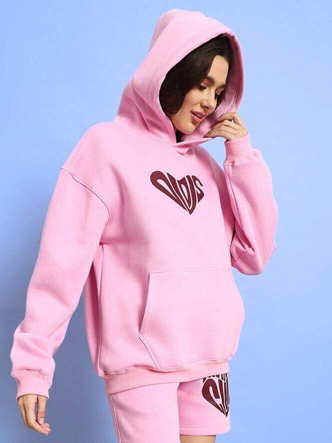 Woman wearing WOMEN LOVERS CLUB FLEECE HOODIE PINK with stylish design, perfect for casual wear and romantic outings.