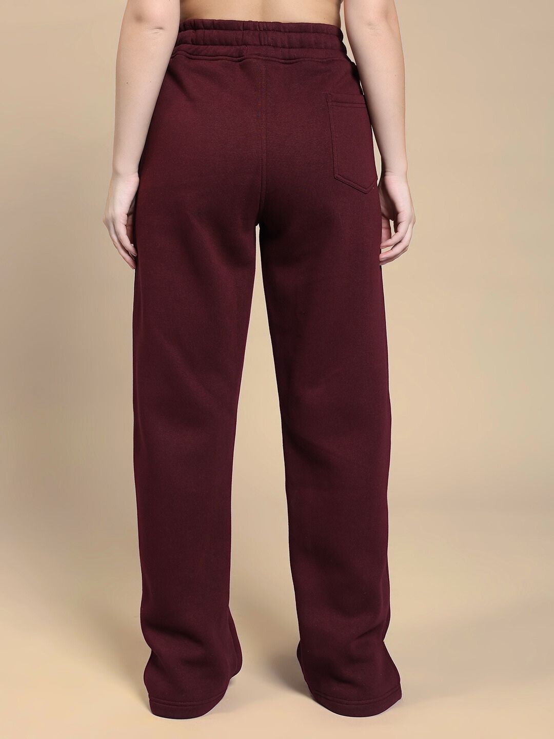 Back view of WOMEN'S SKODA COTTON FLEECE JOGGER MAROON showcasing the comfortable fit and rich maroon color, ideal for casual wear.