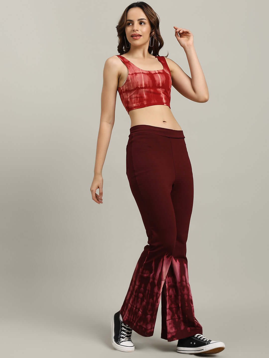 Model wearing Women's Memoria Tie-Dye Co-Ord Set Maroon with crop-top and baggy joggers.
