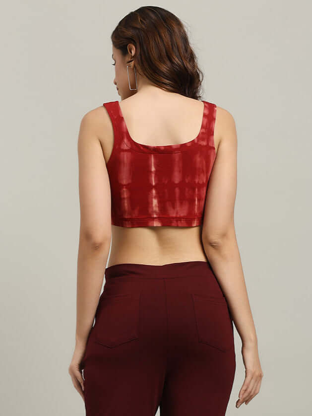 Back view of a woman wearing a maroon tie-dye crop top made from premium cotton Lycra, showcasing its unique design and high-quality fabric.
