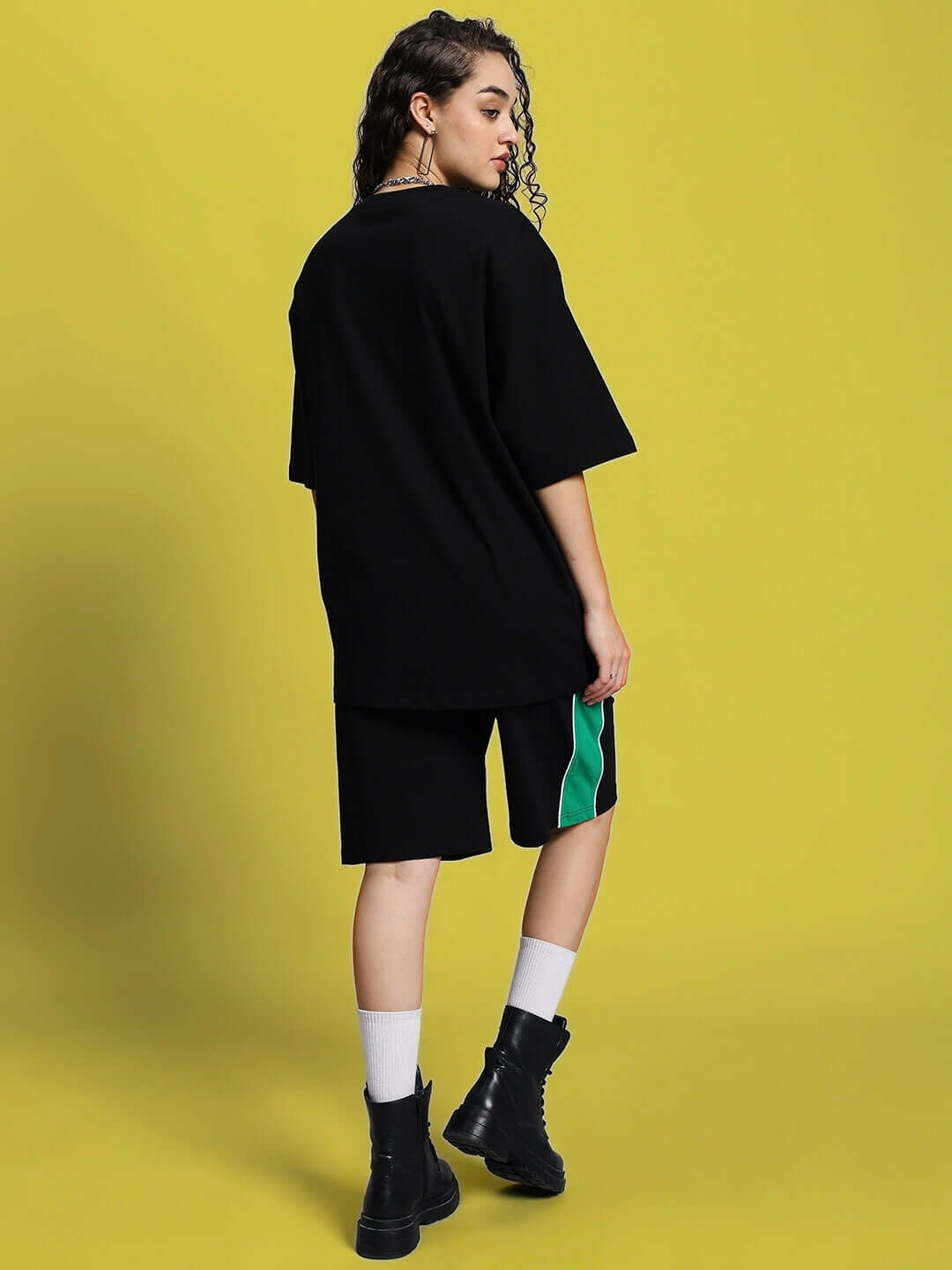 Model wearing WOMEN'S METEORIC SUMMER CO-ORD SET BLACK by WEAR DUDS, featuring a chic and comfortable streetwear design.