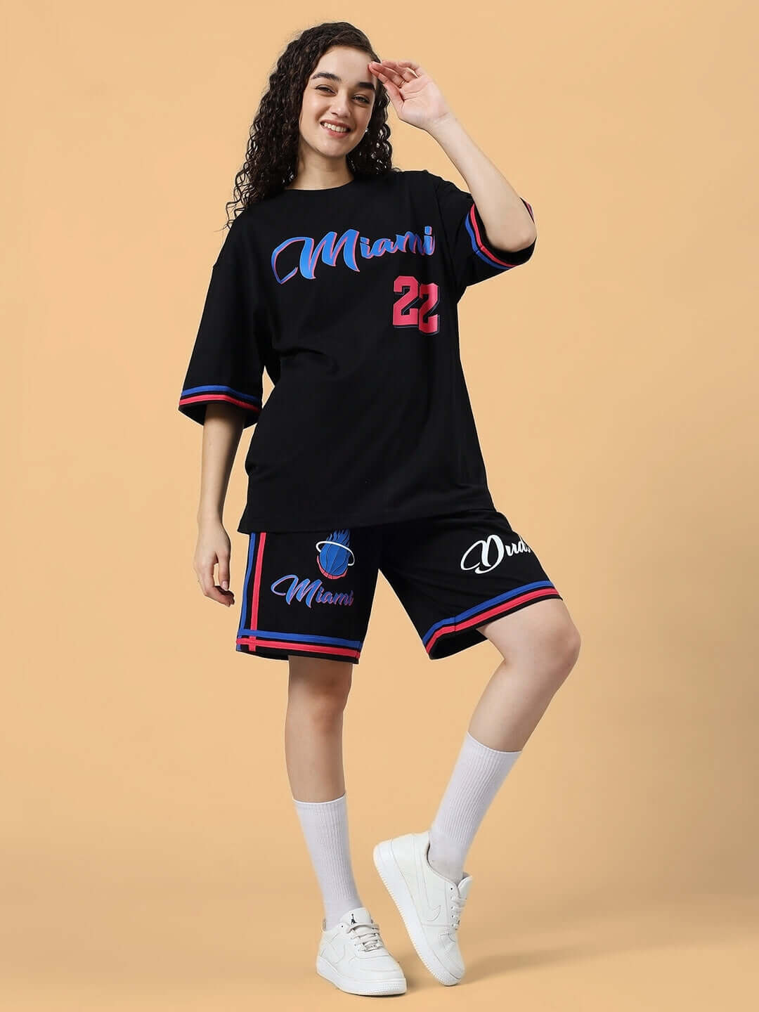 Woman wearing WOMEN'S MIAMI COLORBLOCK CO-ORD SET BLACK with Miami logo and colorful accents, ideal for casual wear.