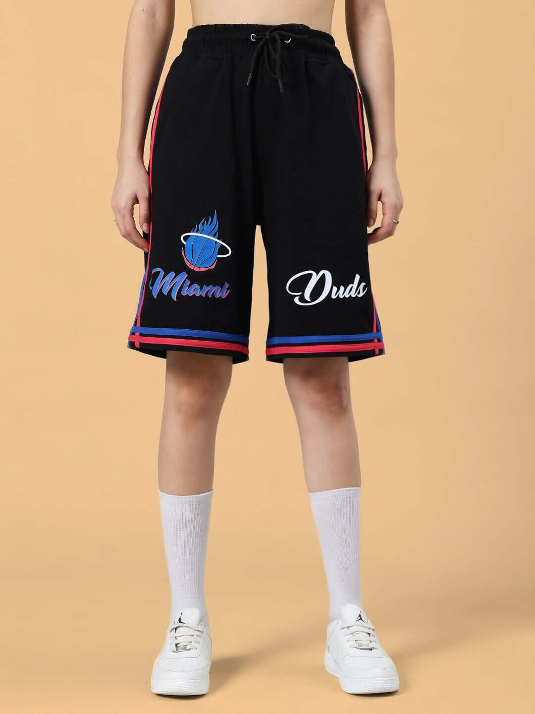 Woman wearing WOMEN'S MIAMI COLORBLOCK CO-ORD SET BLACK with shorts, featuring Miami doodle on premium cotton fabric.